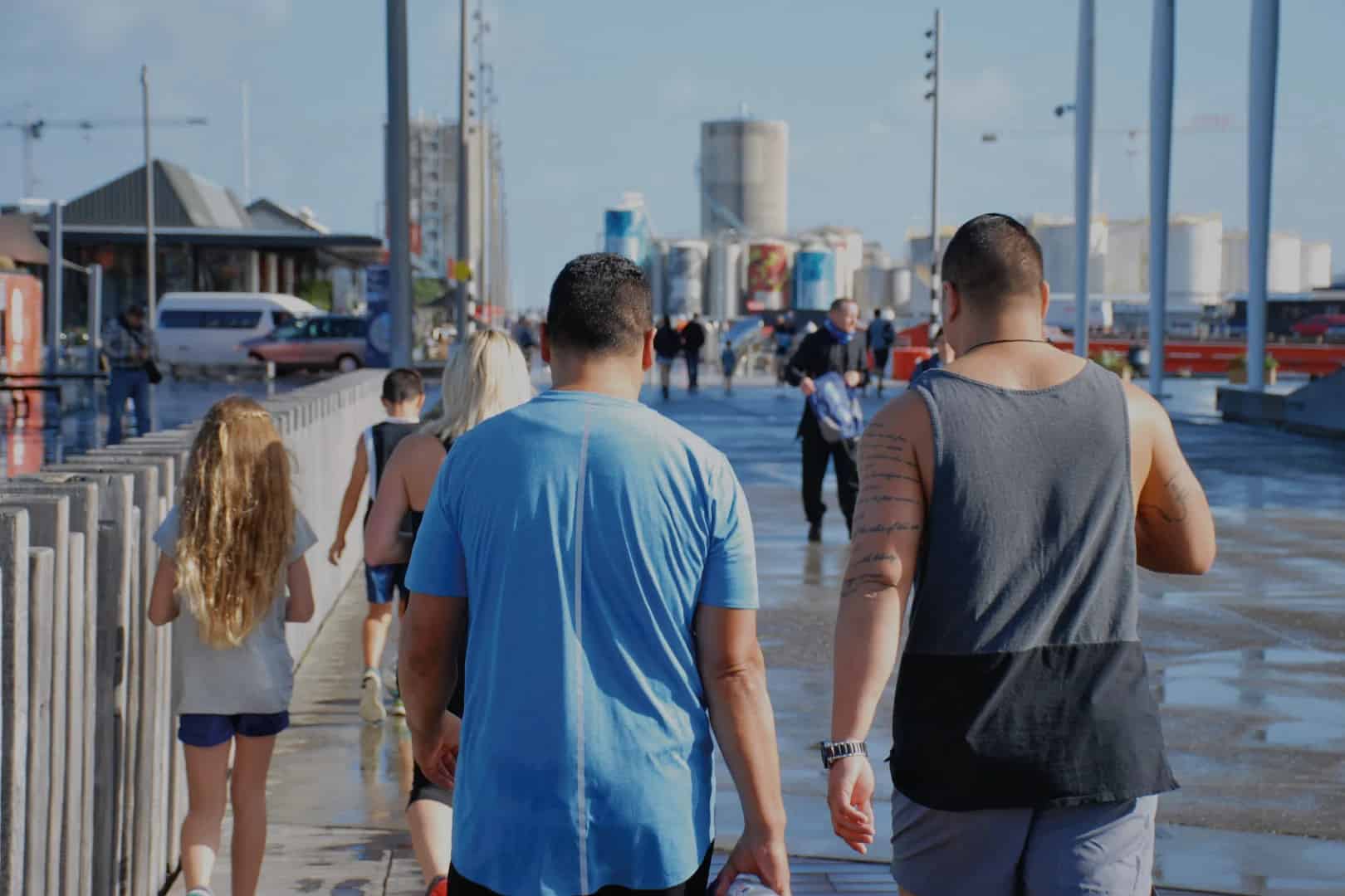 People walking together on the Wellington waterfront near the Foodstuffs distribution centre